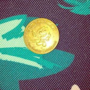 Original Namco arcade coin.